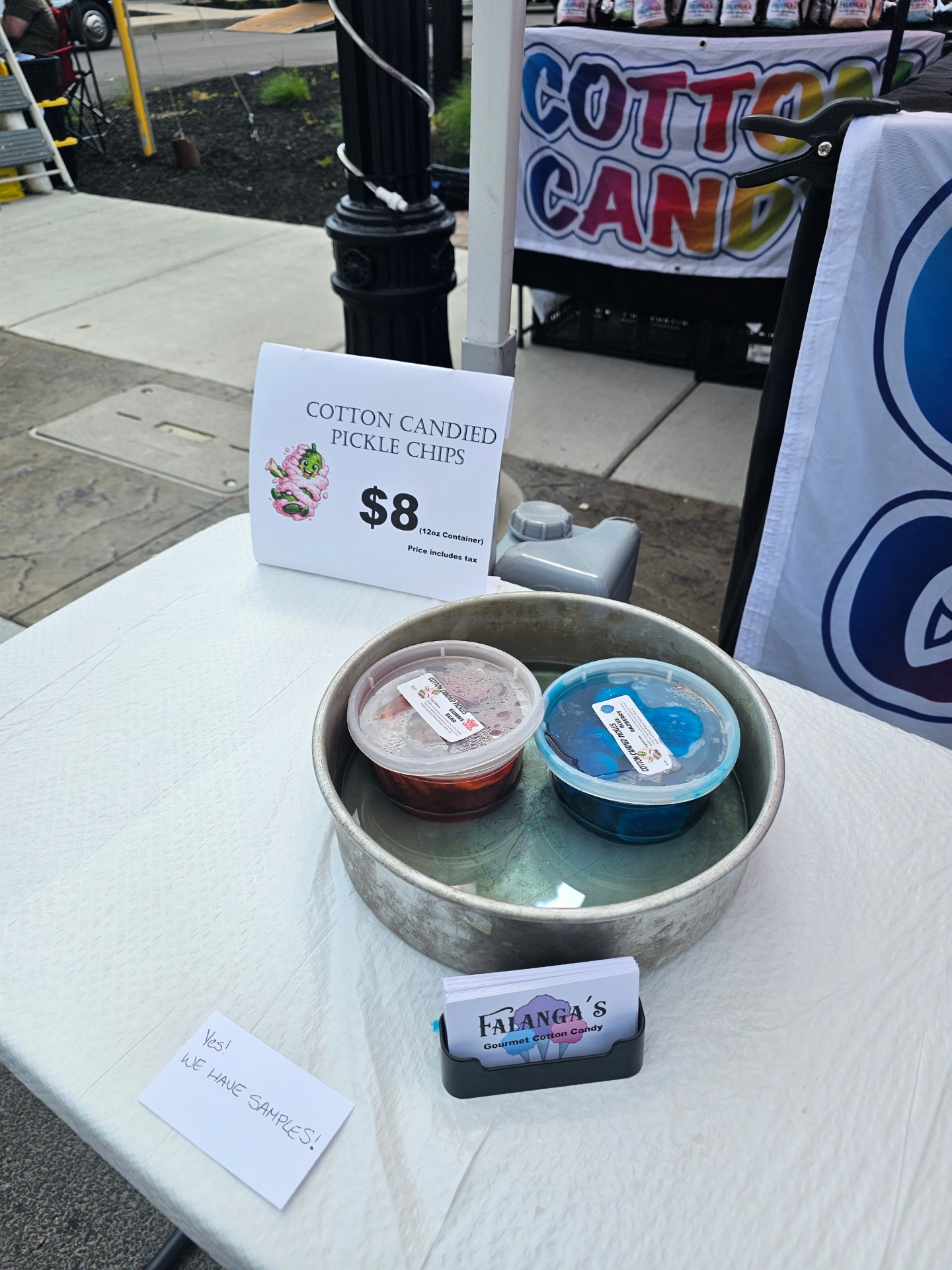 Cotton candied pickle chips sample display with $8 sign at a Falanga's booth