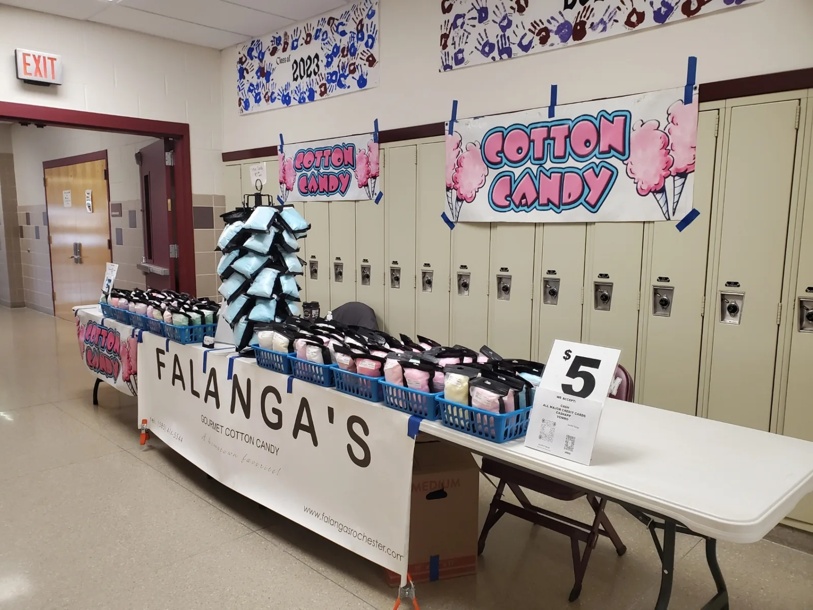 Falanga's cotton candy table set up along a school hallway lined with lockers